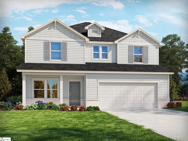 view of front of home with a front lawn and a garage