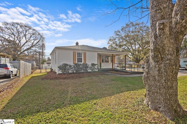 view of front facade with a front yard and a porch