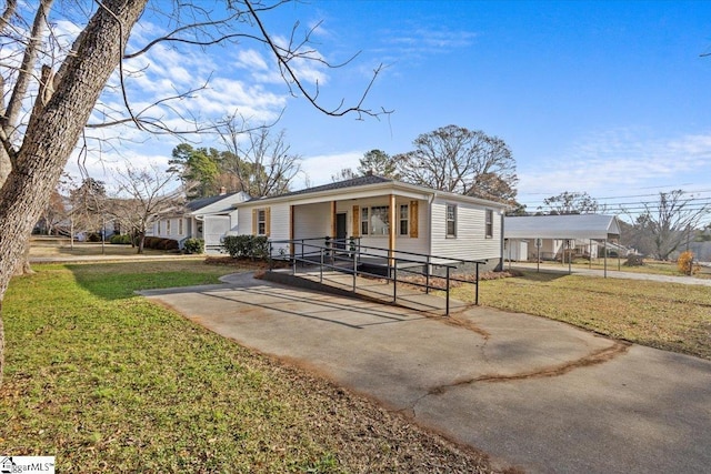 view of front of home with a front lawn and a porch