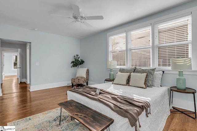 bedroom with hardwood / wood-style flooring and ceiling fan