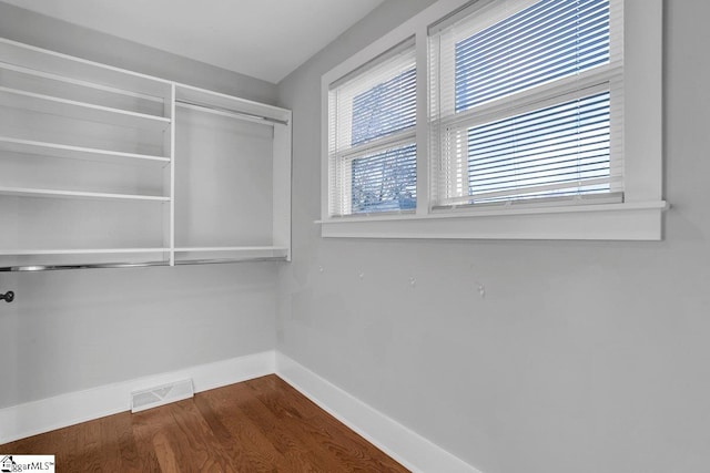 walk in closet featuring hardwood / wood-style flooring