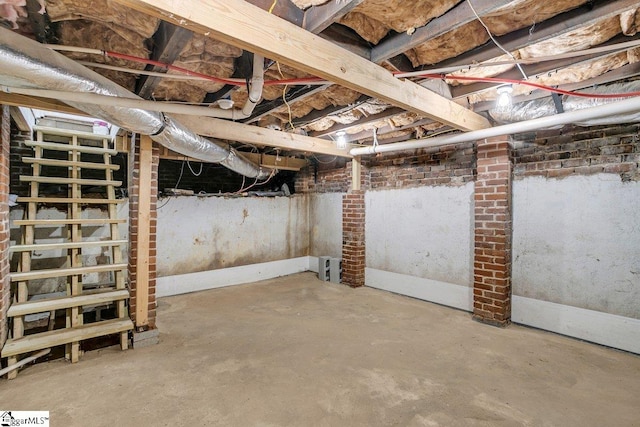 basement with brick wall