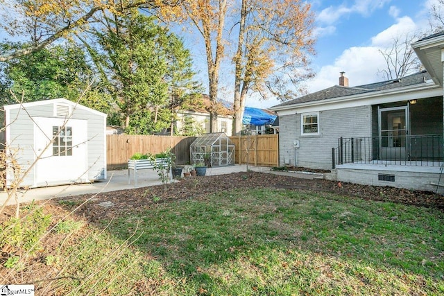 view of yard with a patio and an outdoor structure