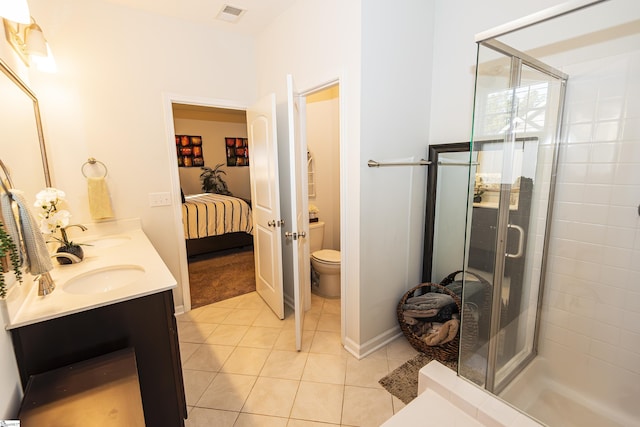 bathroom with walk in shower, tile patterned flooring, vanity, and toilet