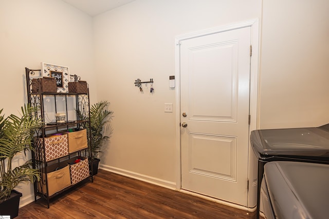 interior space featuring dark hardwood / wood-style floors and washing machine and dryer