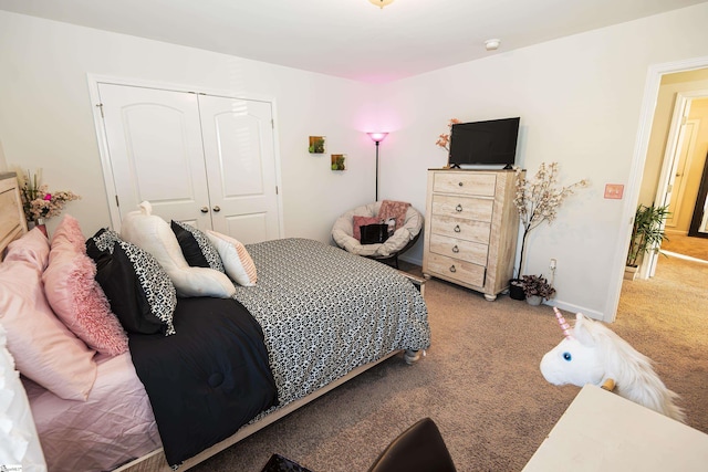 carpeted bedroom featuring a closet