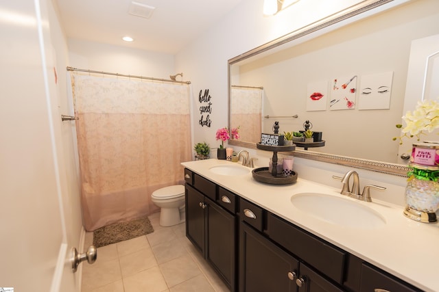 full bathroom with tile patterned floors, vanity, toilet, and shower / bath combo