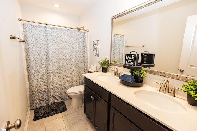 bathroom featuring tile patterned floors, vanity, a shower with shower curtain, and toilet