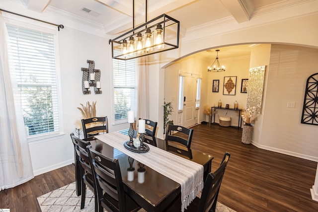 dining space with beam ceiling, dark hardwood / wood-style floors, plenty of natural light, and ornamental molding