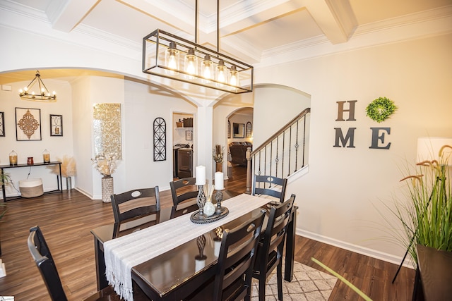 dining room featuring ornamental molding, coffered ceiling, beam ceiling, a chandelier, and dark hardwood / wood-style floors