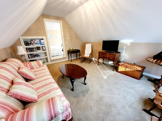 living room featuring carpet floors and lofted ceiling