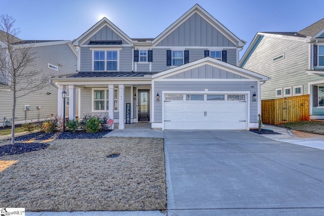 view of front of home featuring covered porch and a garage