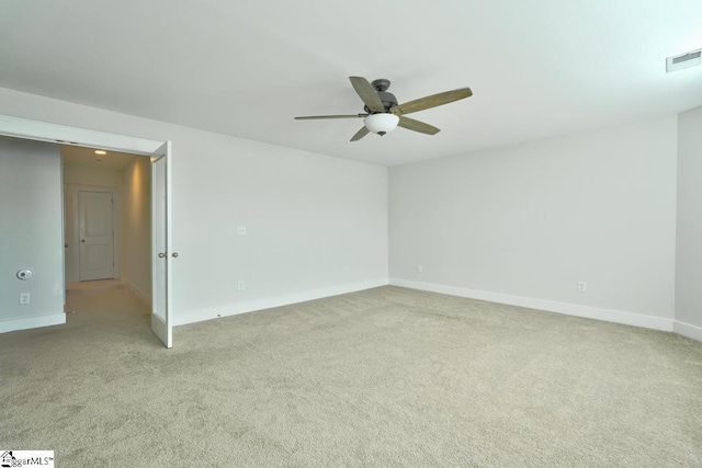 carpeted empty room with ceiling fan