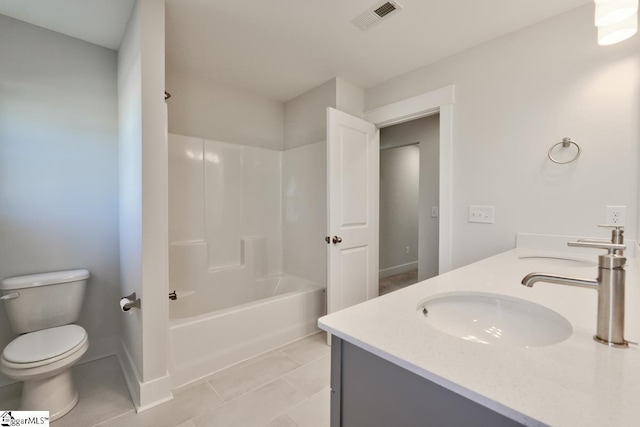 full bathroom featuring tile patterned flooring, vanity, toilet, and shower / washtub combination