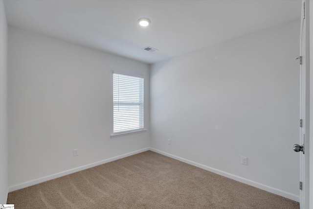 empty room featuring carpet floors