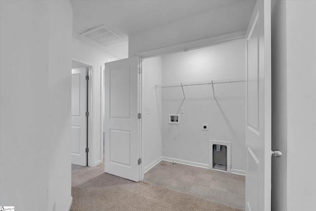 laundry area featuring hookup for a washing machine, light colored carpet, and electric dryer hookup