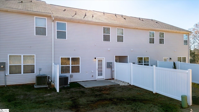 rear view of house featuring cooling unit