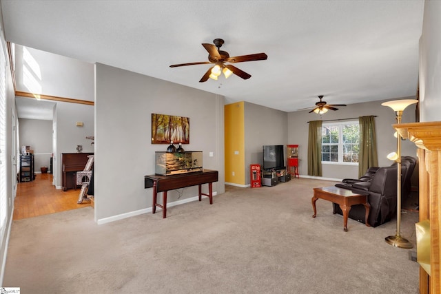 living room featuring ceiling fan and light colored carpet