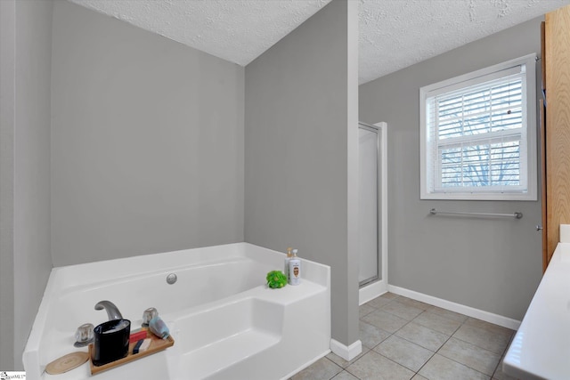 bathroom featuring tile patterned floors, a textured ceiling, and shower with separate bathtub