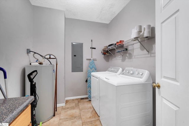 clothes washing area featuring electric panel, gas water heater, light tile patterned floors, separate washer and dryer, and a textured ceiling