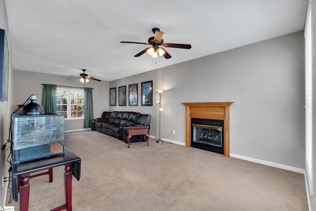 carpeted living room featuring ceiling fan