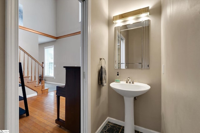 bathroom with hardwood / wood-style floors and sink