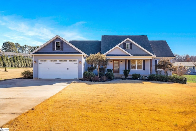 craftsman inspired home featuring a front yard and a garage