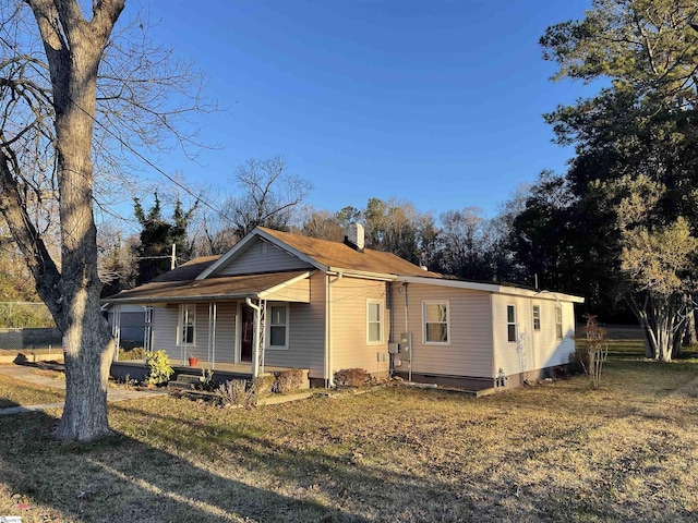 view of front of property with covered porch and a front yard