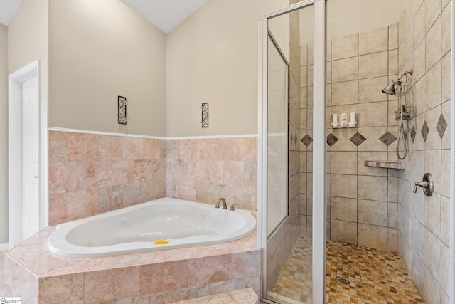 bathroom with shower with separate bathtub