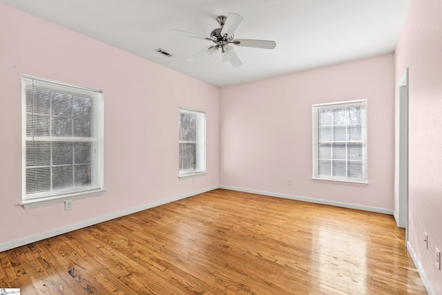 unfurnished room with light hardwood / wood-style flooring and ceiling fan