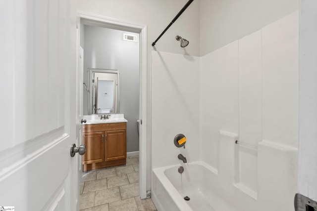 bathroom with vanity and  shower combination