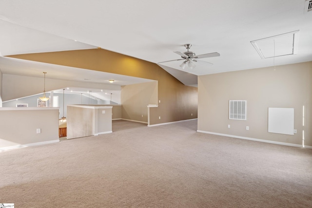 unfurnished living room with ceiling fan, light carpet, and vaulted ceiling