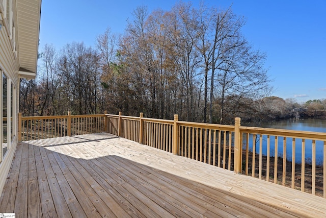 wooden deck featuring a water view