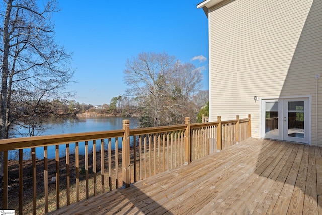 wooden deck featuring a water view