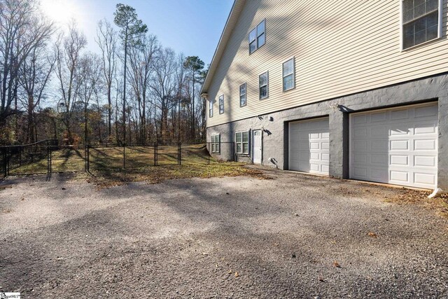 view of property exterior featuring a garage