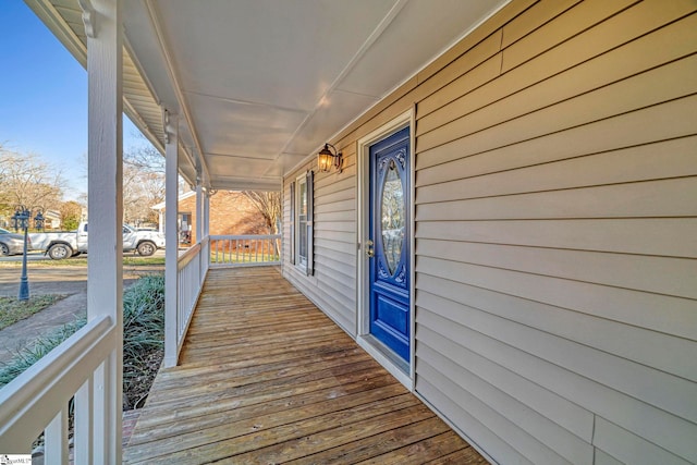 wooden deck featuring covered porch