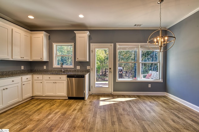 kitchen featuring a chandelier, white cabinetry, stainless steel dishwasher, and ornamental molding