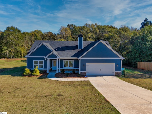 view of front facade with a front lawn and a garage