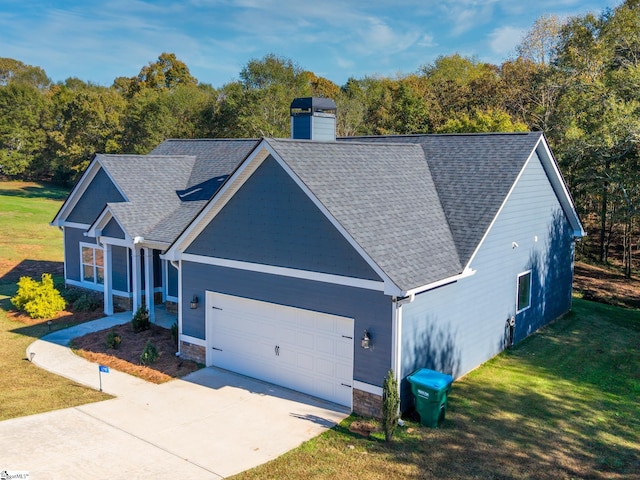 view of front facade with a front yard and a garage