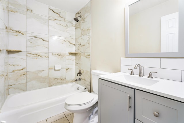 full bathroom with tiled shower / bath combo, tile patterned flooring, toilet, decorative backsplash, and vanity