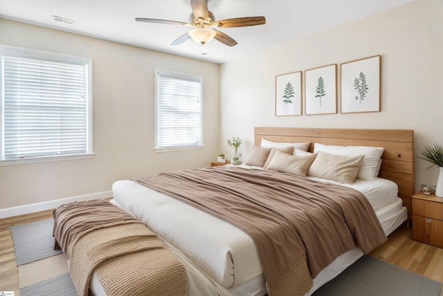 bedroom featuring ceiling fan and light wood-type flooring