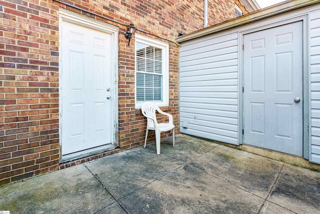 doorway to property with a patio area