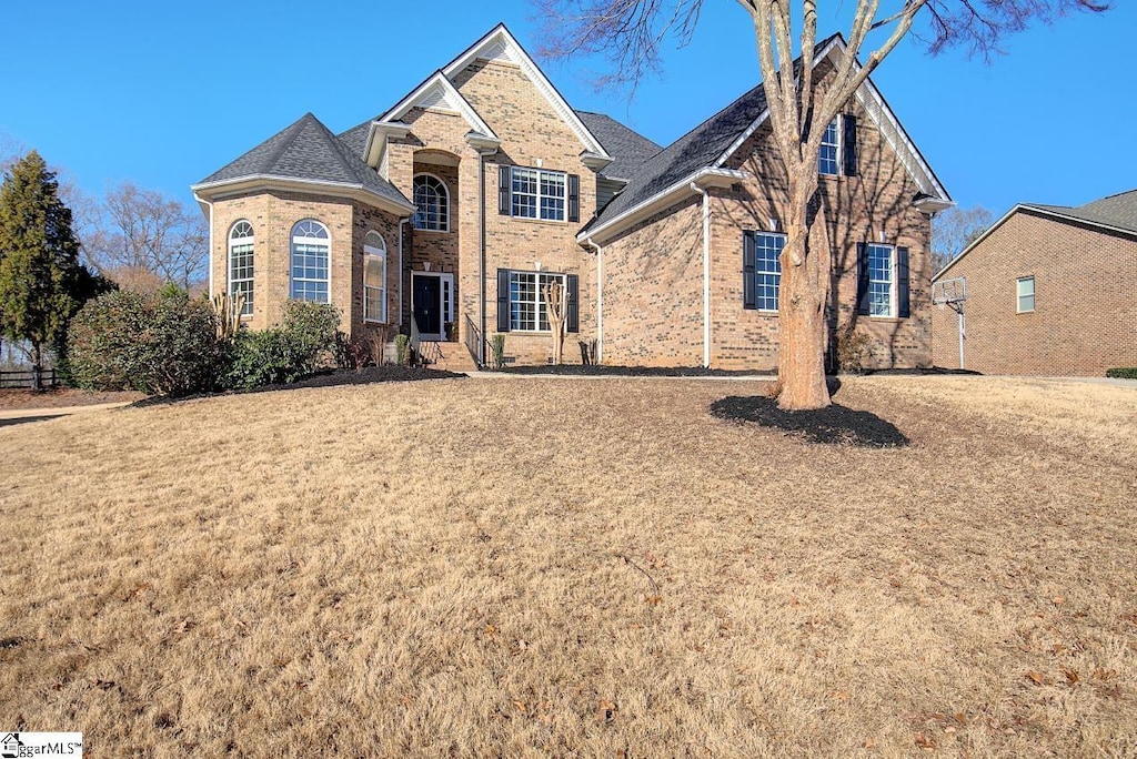 front facade with a front lawn