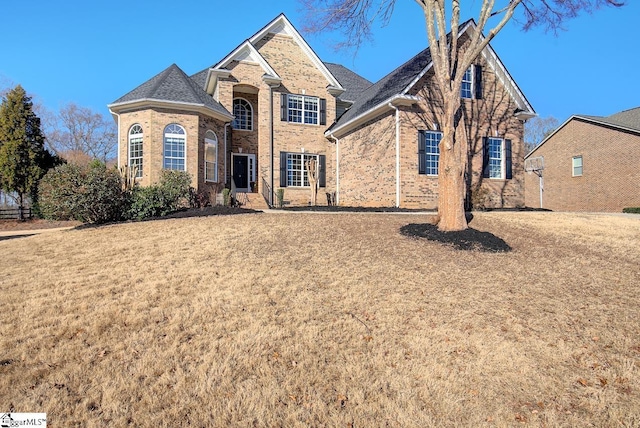 front facade with a front lawn