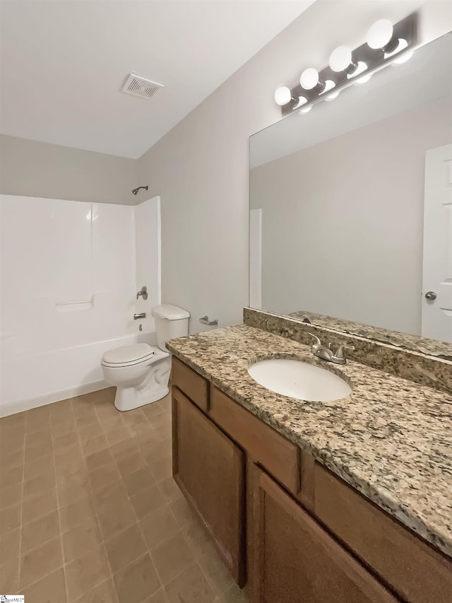 full bathroom with tile patterned flooring, shower / tub combination, vanity, and toilet