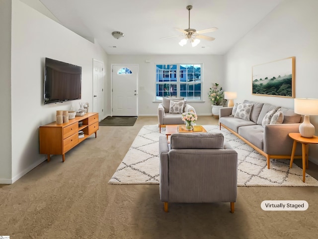 carpeted living room with ceiling fan