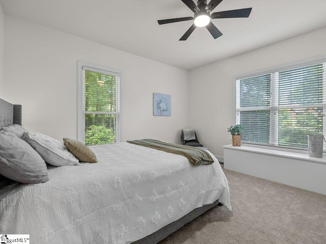 carpeted bedroom featuring ceiling fan