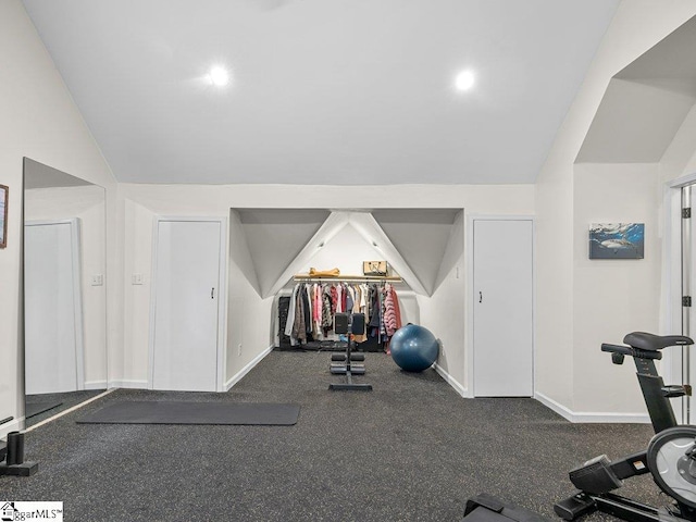 workout area with vaulted ceiling