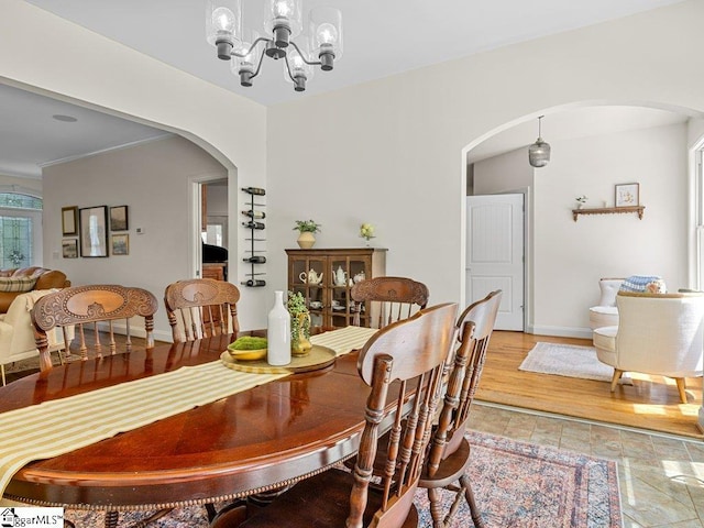 dining space featuring a notable chandelier