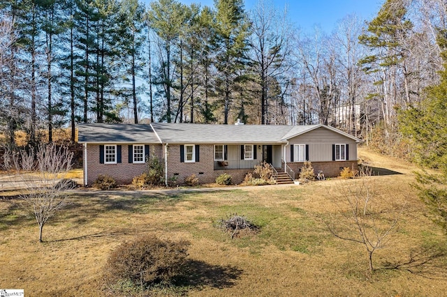 ranch-style home featuring a porch and a front yard